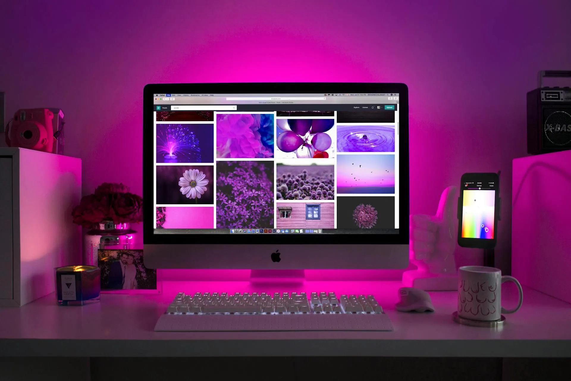 Laptop displaying modern website design on a creative workspace desk